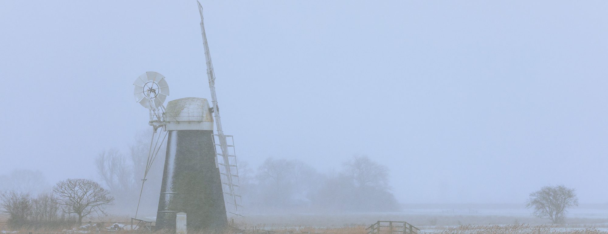 Mutton's Mill on the Halvergate Marshes in winter mist and snow